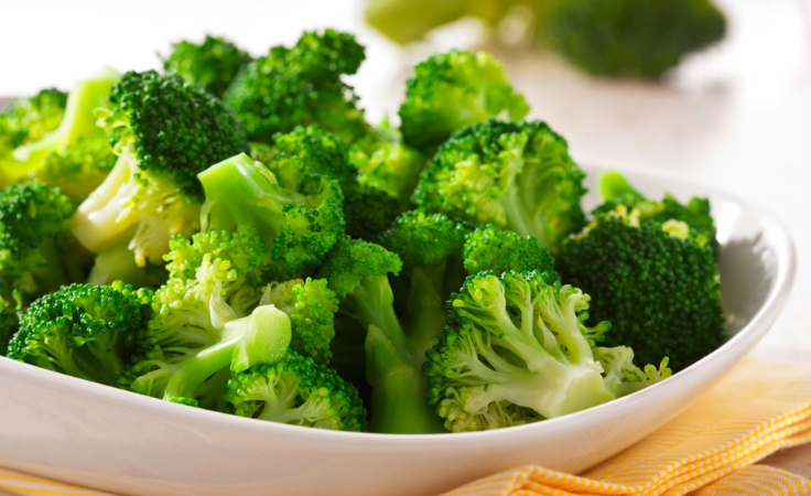 minced broccoli on white bowl ready to be served for healthy brain
