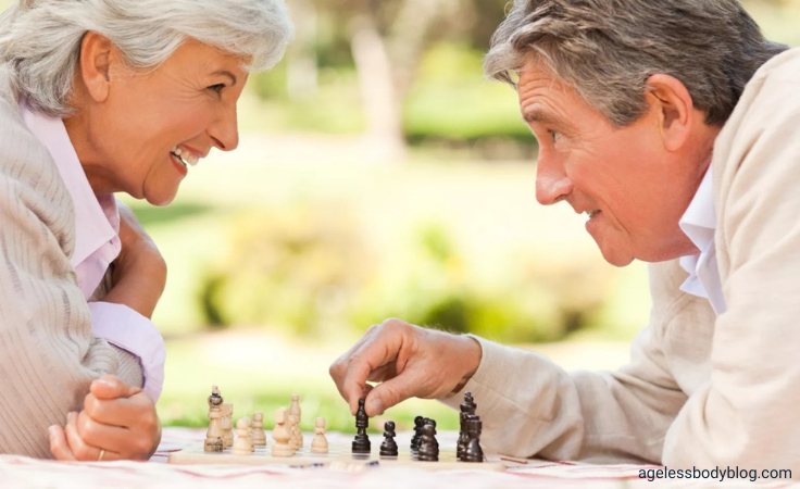 senior citizens play chess in their balance exercises program